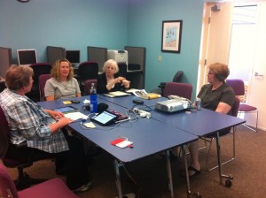 You can see the tablet on the table which picked up the captions.  The captions were also projected onto a screen on the wall also.